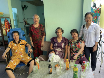 Figure 1: Ms Ritu and Le from USAID/Vietnam and VANH beneficiaries in Bac Lieu Province
