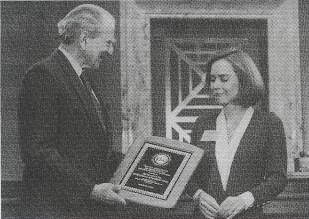 Presentation: At the breakfast, Adm. Elmo Zumwalt, Honorary Chairman of VNAH's Advisory Board, presents an appreciation plaque to Amb. Sally Shelton of USAID